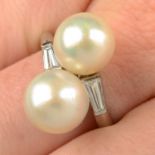 A cultured pearl two-stone crossover ring, with tapered baguette-cut diamond shoulders.