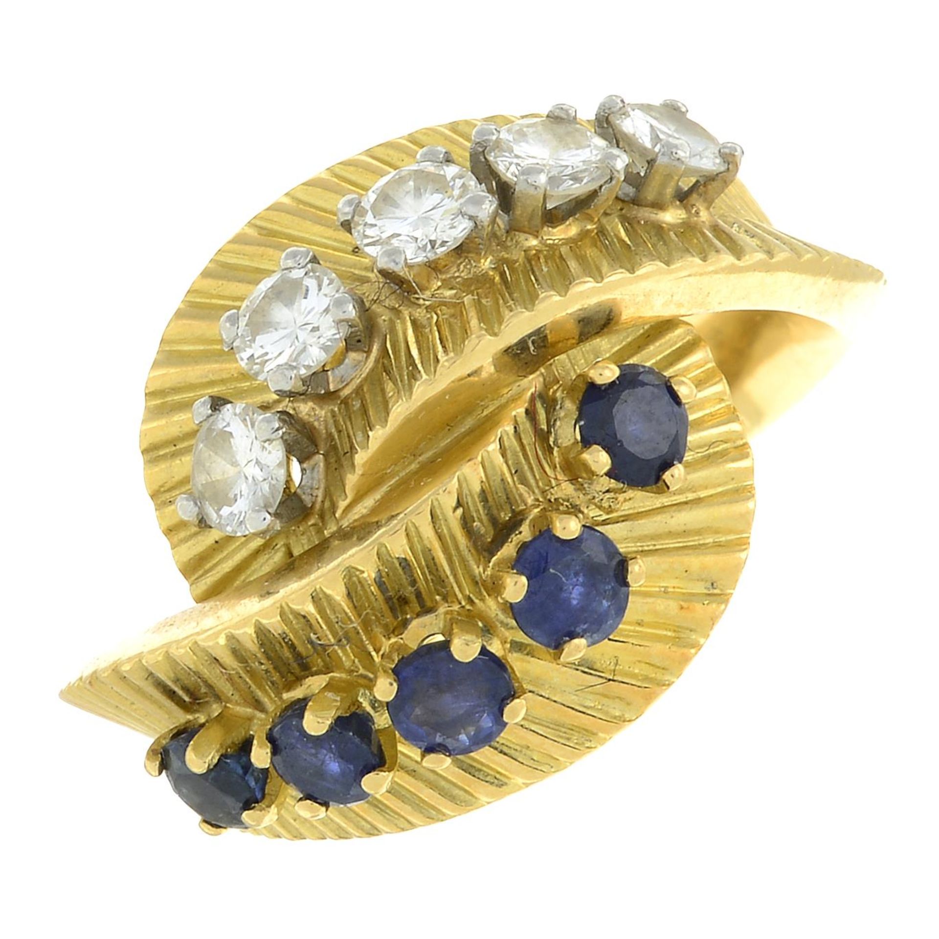 A 1960s sapphire and diamond crossover dress ring.Estimated total diamond weight 0.60ct, - Image 2 of 8