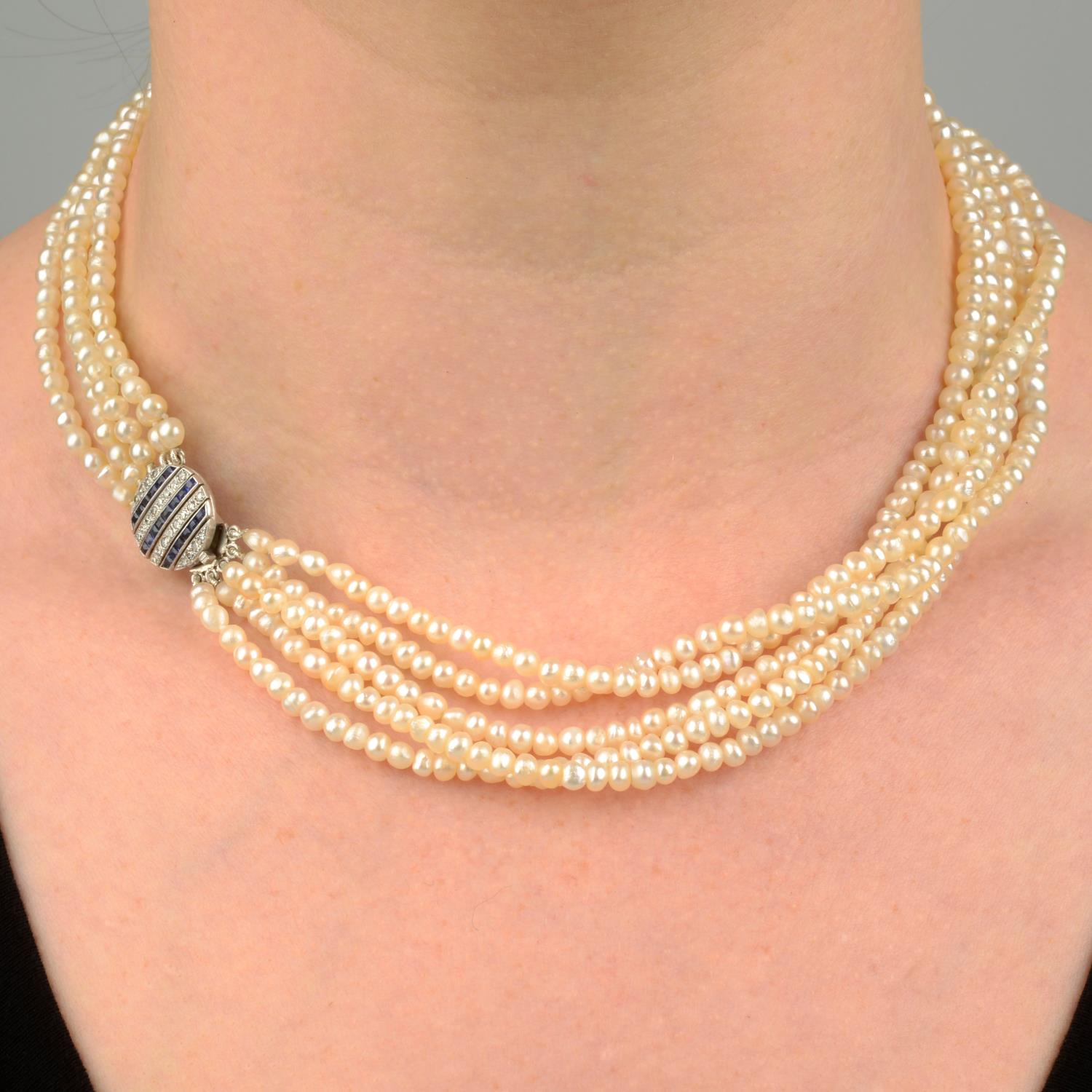 A natural pearl five-strand necklace, with sapphire and diamond clasp.