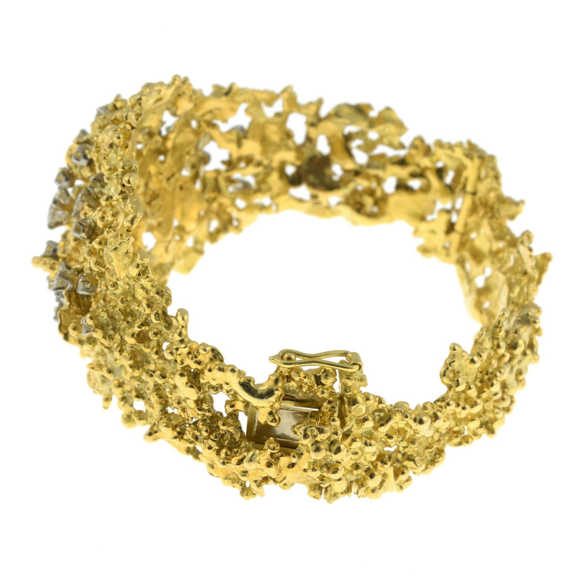 A 1970's textured openwork 18ct gold and scattered brilliant-cut diamond hinged bangle, - Image 6 of 7