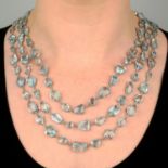 An 18ct gold multifaceted aquamarine graduated three-strand necklace,