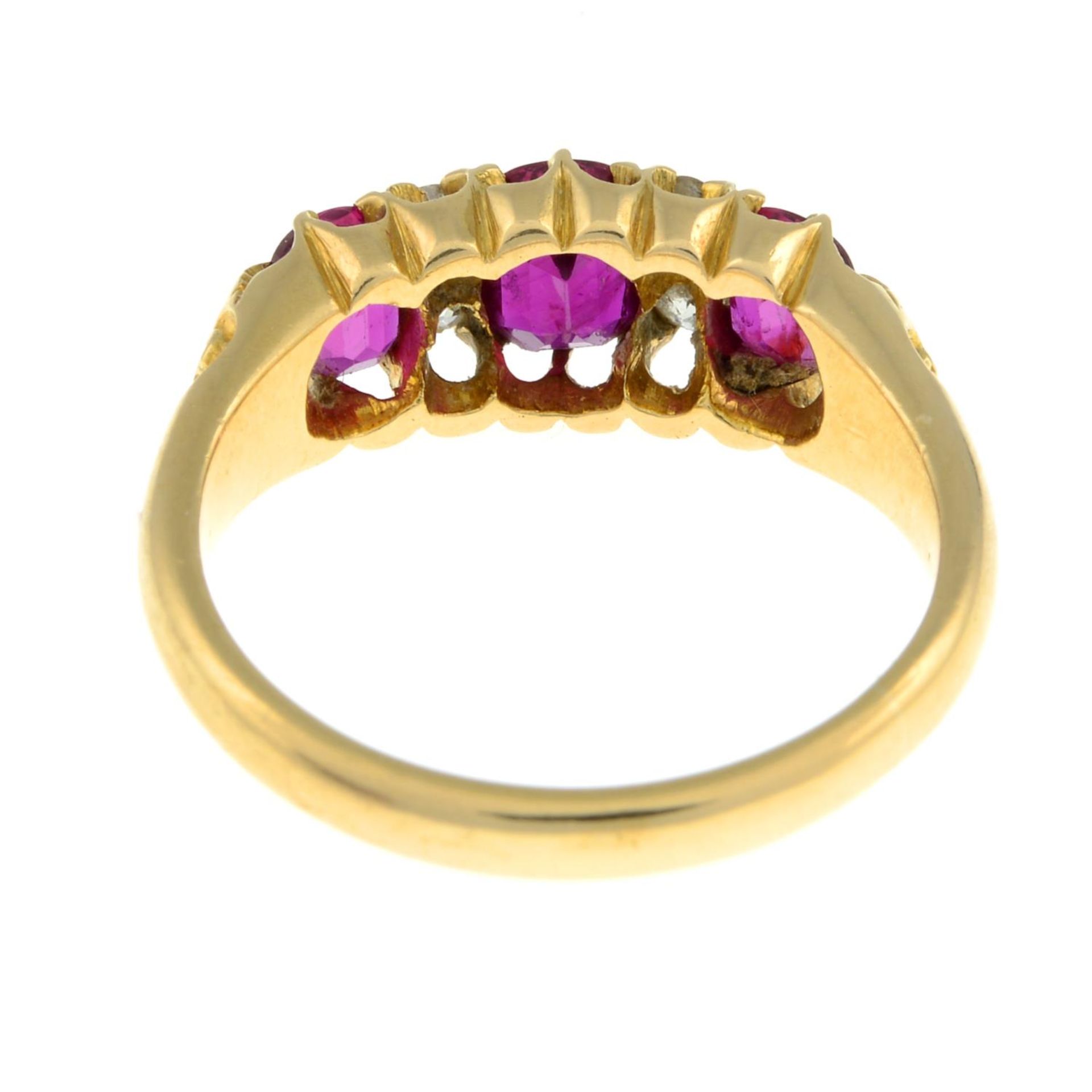 An Edwardian 18ct gold Thai ruby three-stone and diamond ring.Verbal from GCS, - Image 7 of 9