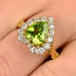 A heart-shape peridot and brilliant-cut diamond cluster ring.Peridot calculated weight 2.82cts,
