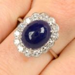 A sapphire cabochon and single-cut diamond cluster ring.