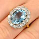 An 18ct gold aquamarine and diamond cluster ring.