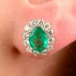 A pair of 18ct gold emerald and brilliant-cut diamond cluster earrings.Total emerald weight