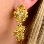 A pair of 1970's textured openwork and scattered brilliant-cut diamond earrings,