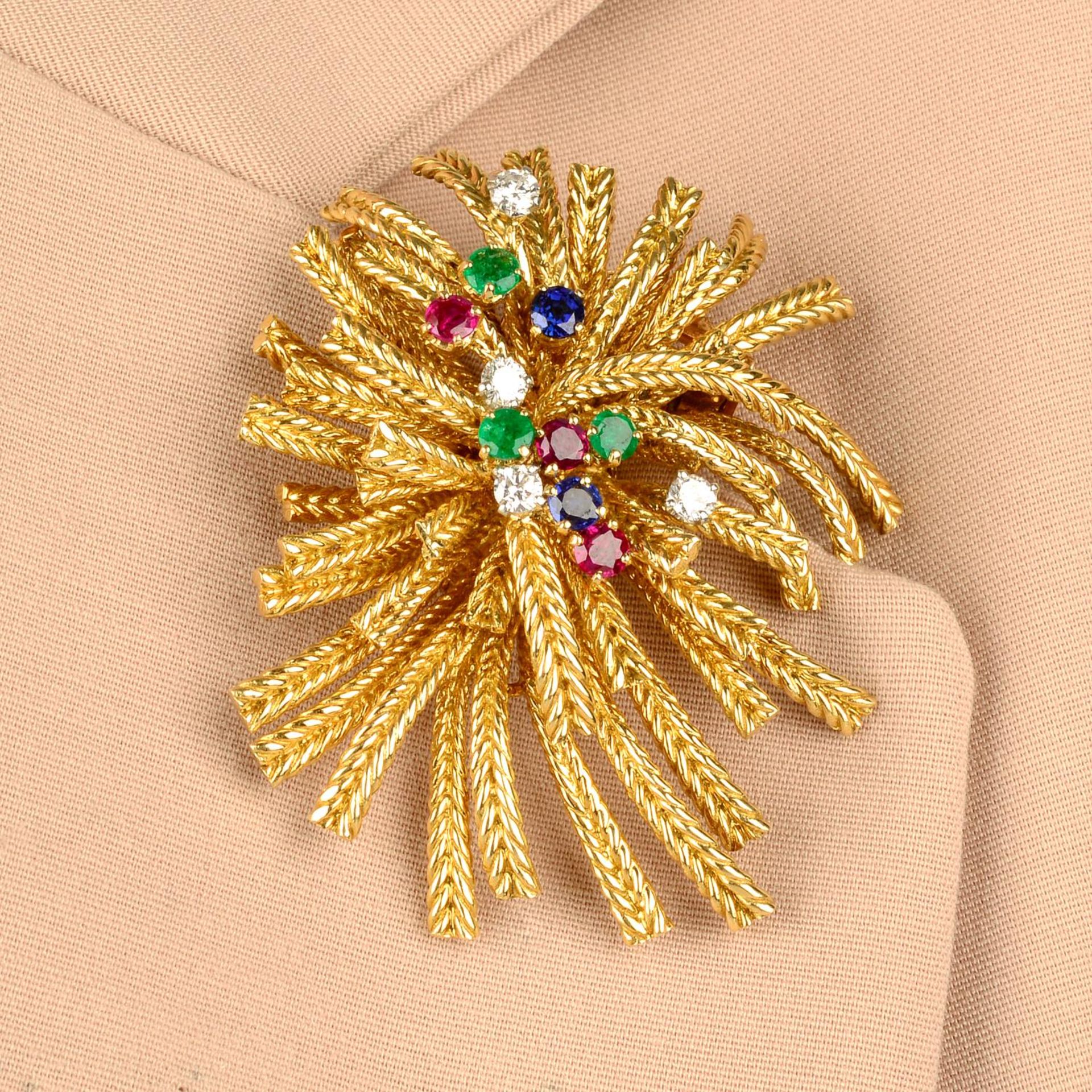 A mid 20th century 18ct gold ruby, sapphire, emerald and diamond spray brooch, by Cartier.