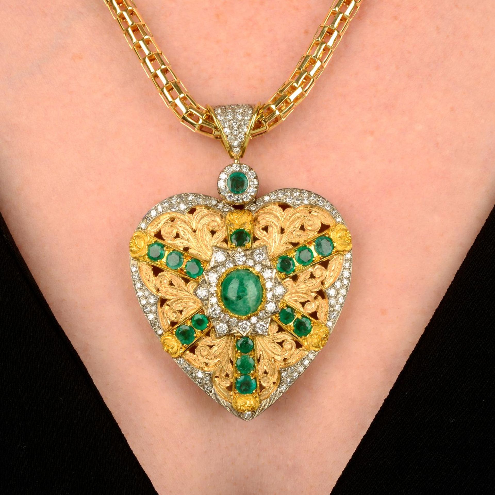 An emerald and diamond heart pendant, with fancy-link chain.