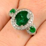 An emerald and diamond dress ring.