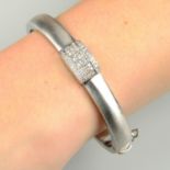 A vari-cut diamond panel highlight hinged bangle,