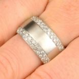 A pavé-set diamond band ring.