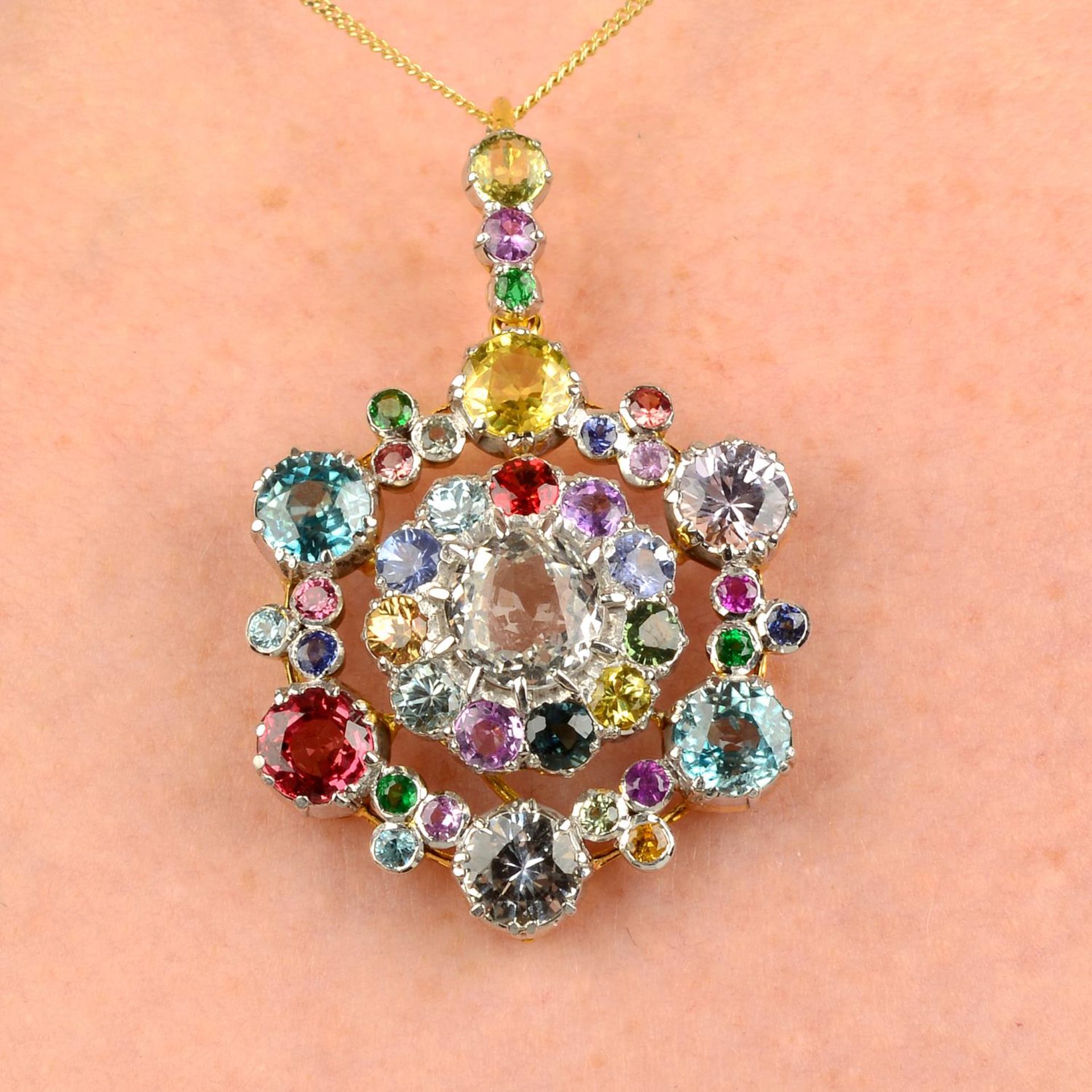 A multi-gem cluster pendant, to include vari-hue sapphires and zircons.Length 4.5cms.