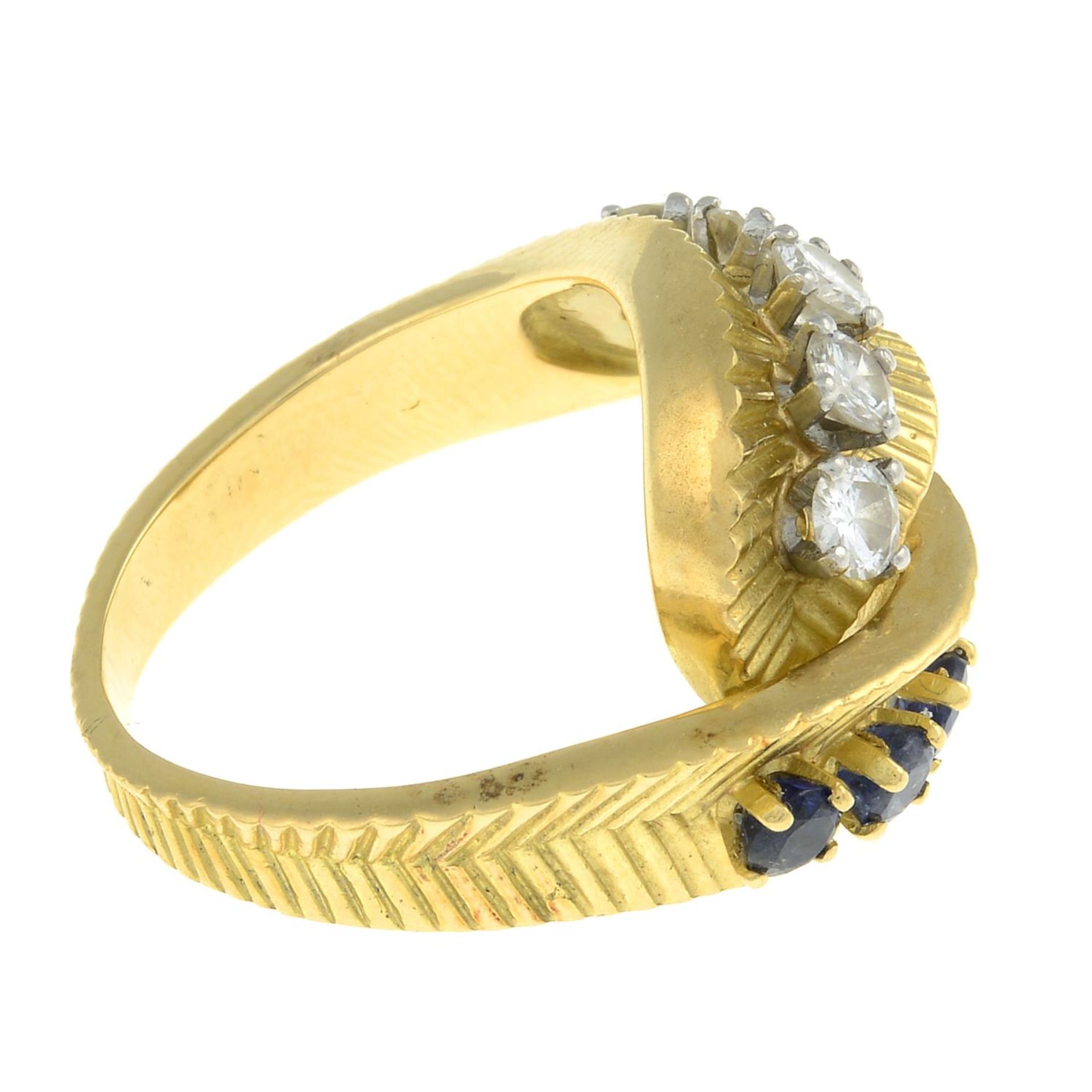 A 1960s sapphire and diamond crossover dress ring.Estimated total diamond weight 0.60ct, - Bild 7 aus 8