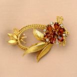 A mid 20th century 18ct gold citrine and diamond floral brooch.