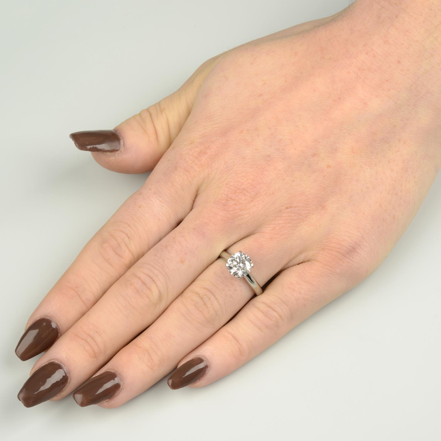 A platinum brilliant-cut diamond single-stone ring. - Image 5 of 9