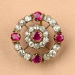 A late Victorian silver and gold, ruby and old-cut diamond target cluster brooch.