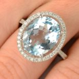 An 18ct gold aquamarine and diamond cluster ring.