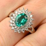 An emerald and brilliant-cut diamond cluster ring.Emerald calculated weight 1.33cts,