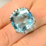 An aquamarine and diamond dress ring.