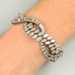 A mid 20th century marquise-shape and baguette-cut diamond bracelet.