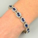 A sapphire and brilliant-cut diamond graduated cluster bracelet.Estimated total diamond weight