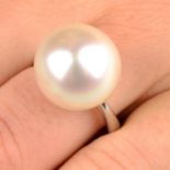 A South Sea cultured pearl ring, by Carl Bucherer.Estimated diameter 15.1mms.Stamped 750.