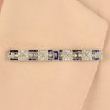 An Art Deco platinum, synthetic sapphire and rose-cut diamond bar brooch.Length 7.2cms.