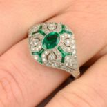 An emerald and diamond dress ring.