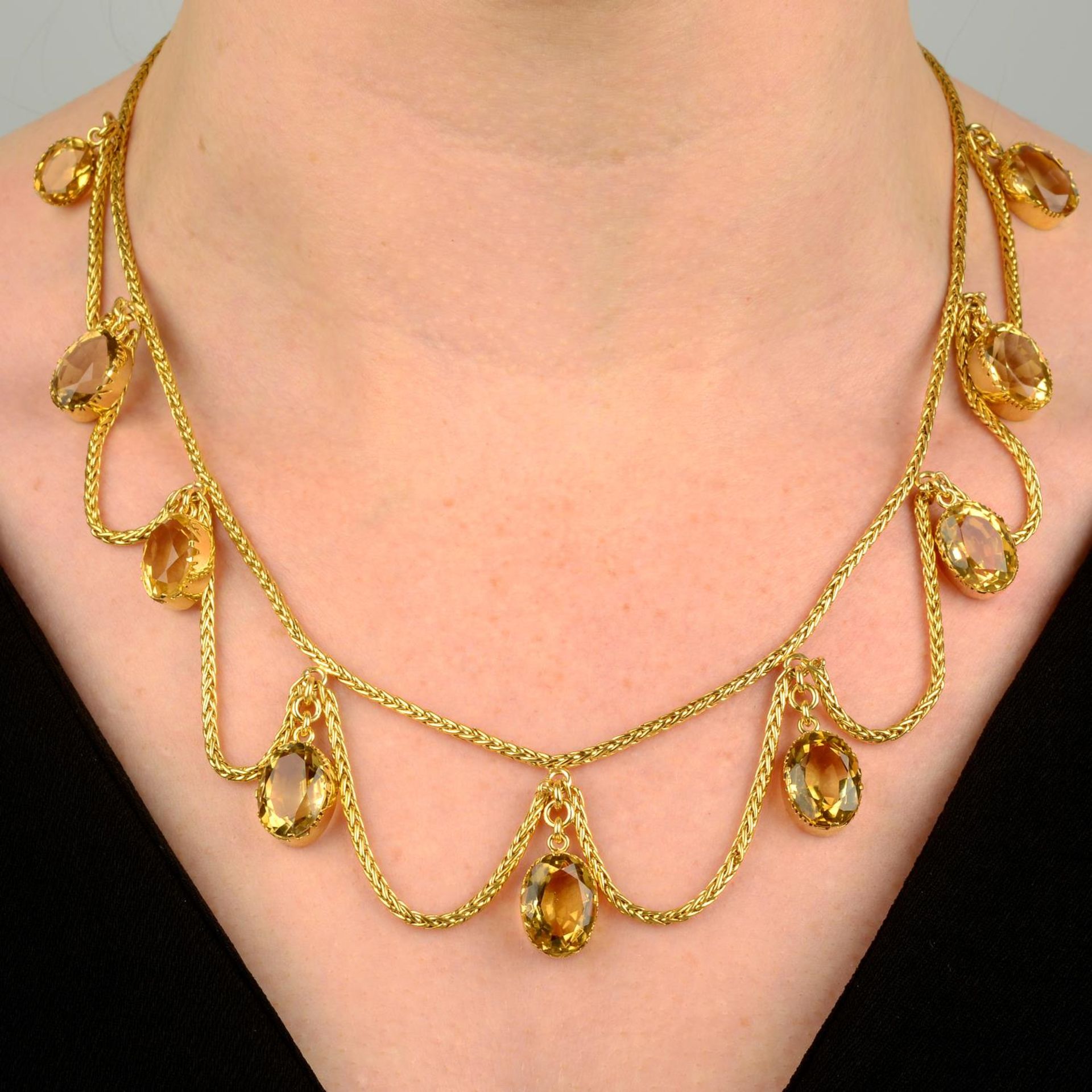 A late Victorian gold citrine and swag fringe necklace.Length 45.8cms.