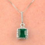 An emerald and diamond cluster pendant.