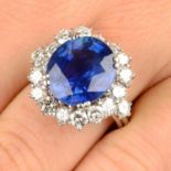 A Burmese sapphire and brilliant-cut diamond cluster ring.