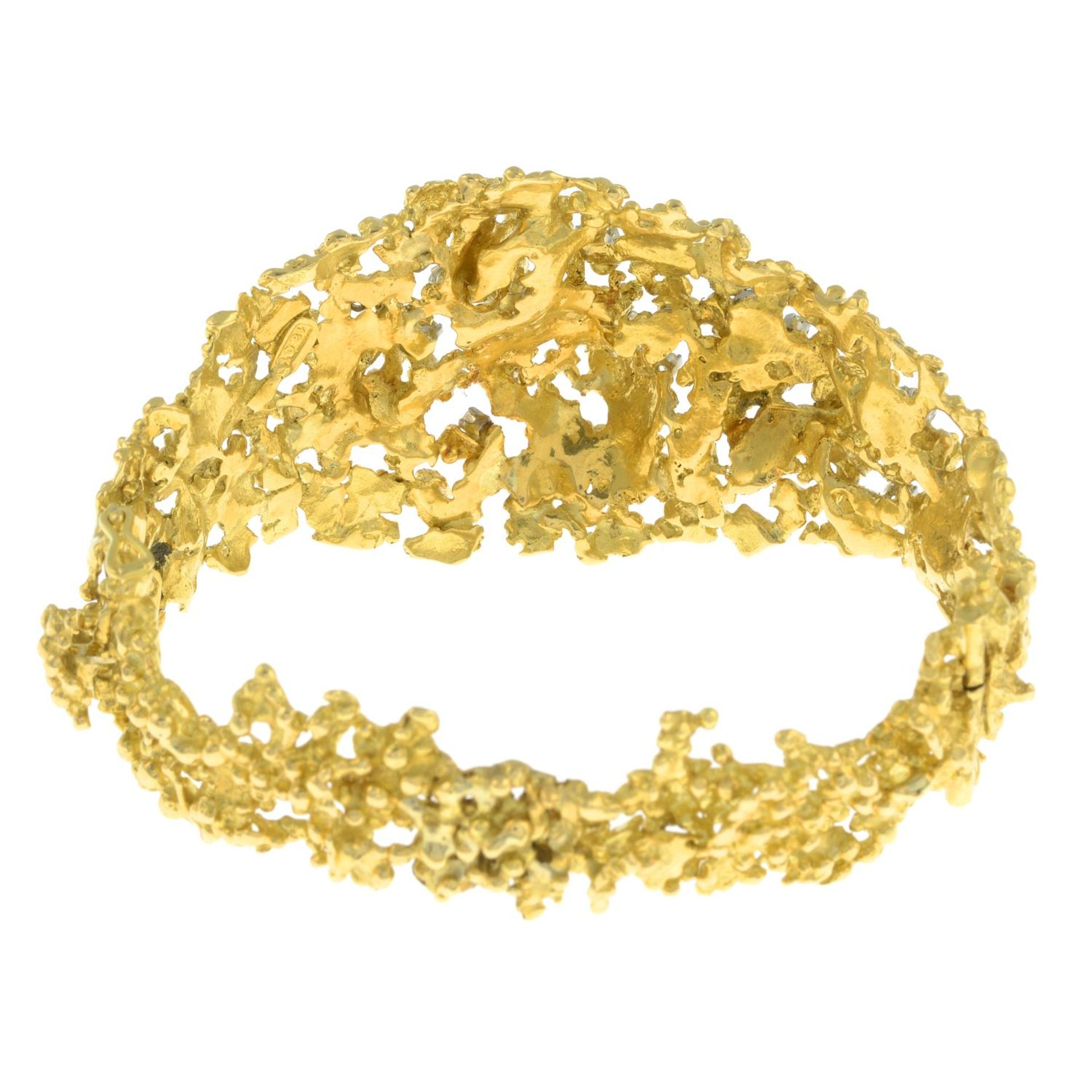 A 1970's textured openwork 18ct gold and scattered brilliant-cut diamond hinged bangle, - Image 5 of 7