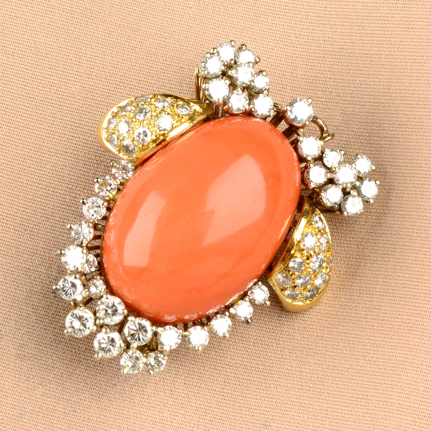 A coral and diamond brooch.Estimated total diamond weight 2.75cts,