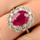 An 18ct gold ruby and vari-cut diamond cluster ring.