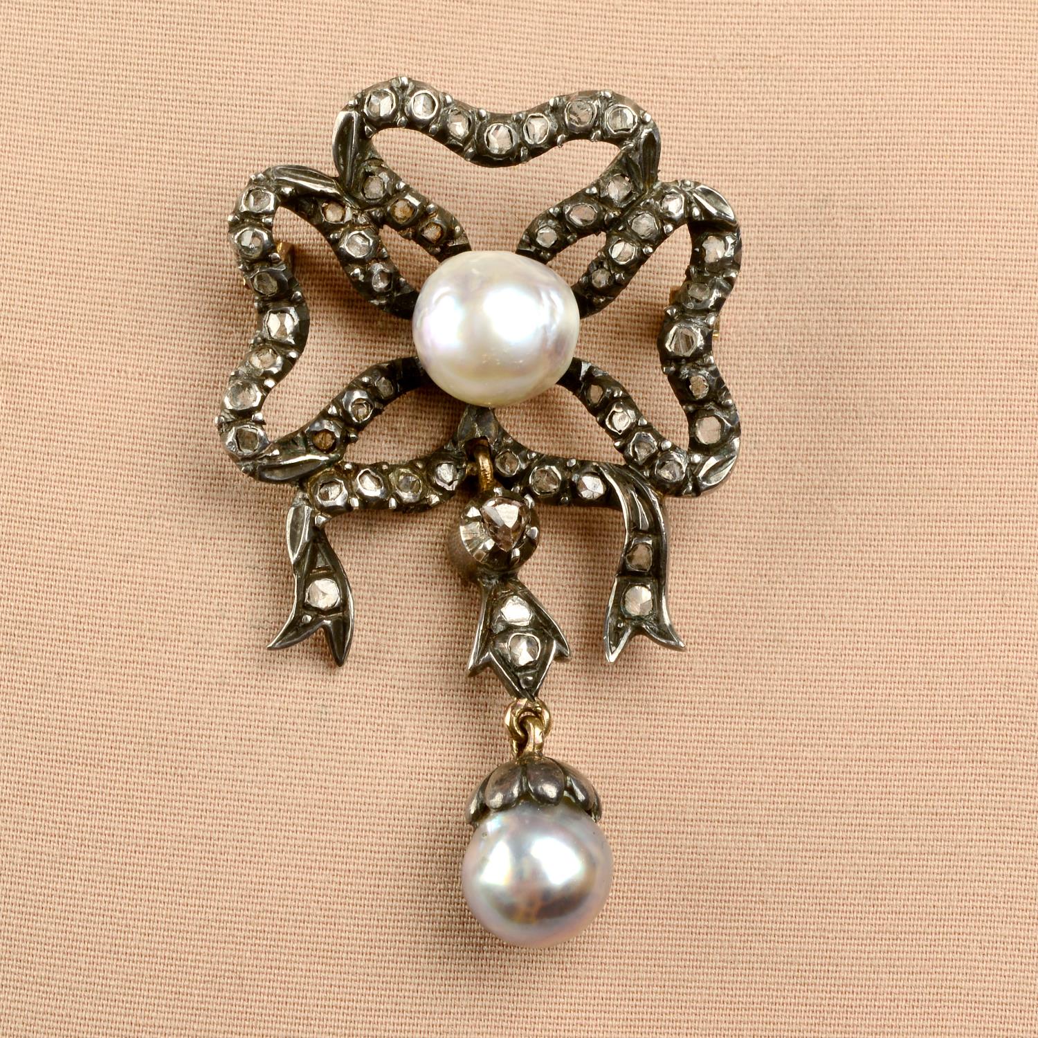 A late 19th century silver and gold, pearl and rose-cut diamond bow brooch.