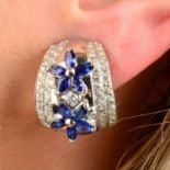 A pair of sapphire and brilliant-cut diamond floral hoop earrings.Estimated total diamond weight