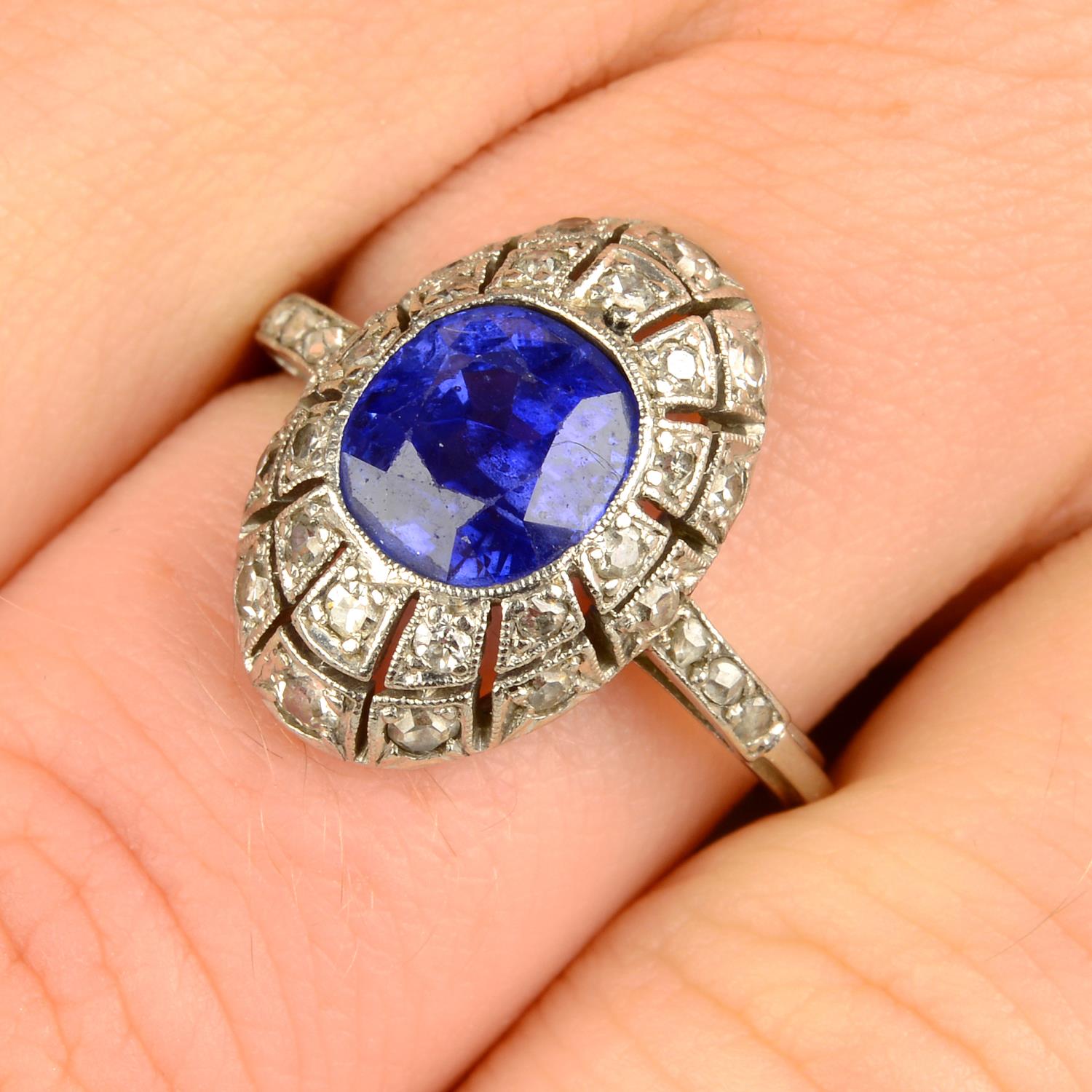 An Art Deco platinum sapphire and diamond dress ring.Sapphire calculated weight 2.31cts,