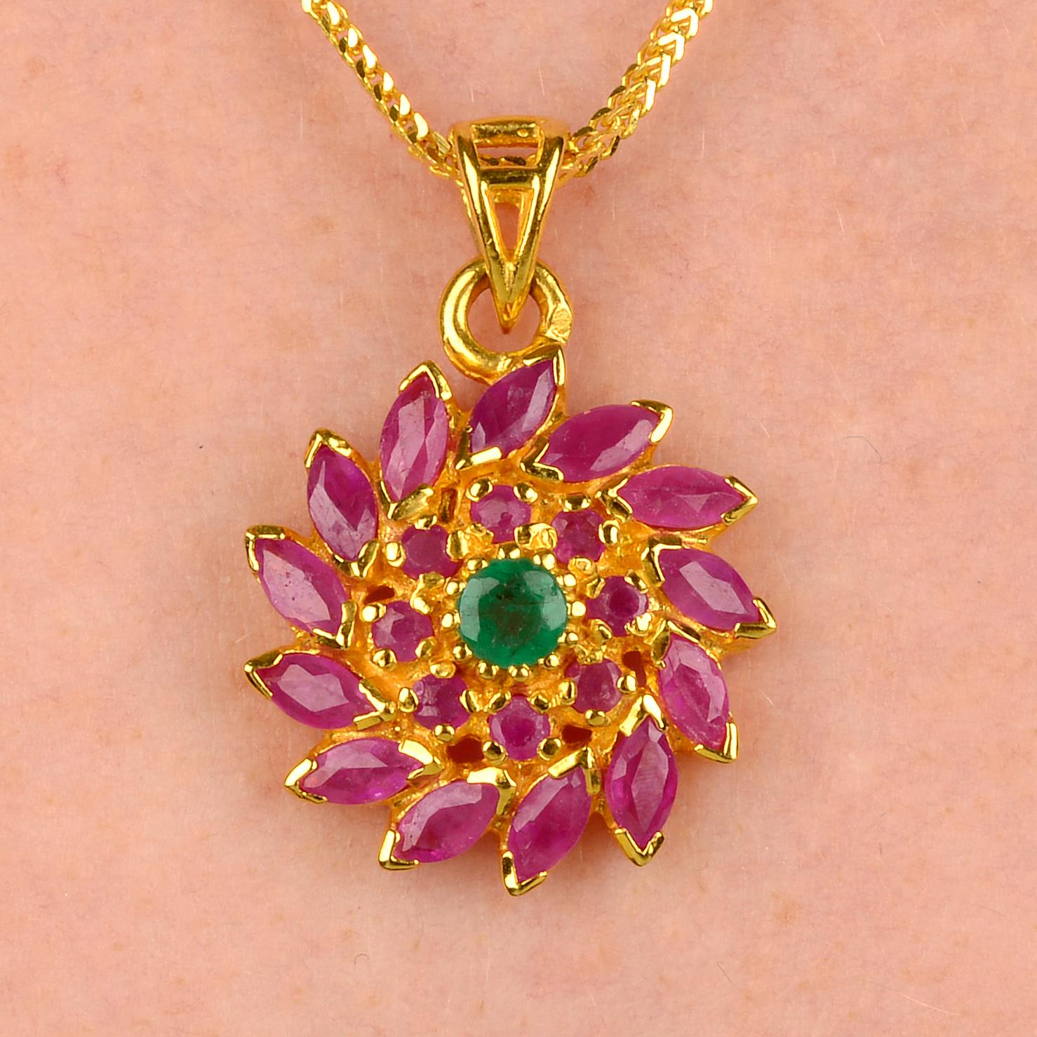 A ruby and emerald floral cluster pendant and chain, with matching earrings.