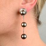 A pair of Tahitian cultured pearl and diamond drop earrings.