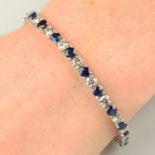 A sapphire and diamond line bracelet.