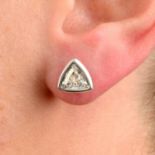 A pair of triangular-shape diamond collet stud earrings.