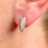 A pair of pavé-set diamond 'Étincelle' hoop earrings, by Cartier.