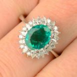 An 18ct gold emerald and vari-cut diamond cluster ring.