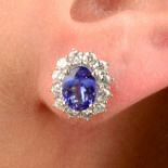 A pair of 18ct gold tanzanite and brilliant-cut diamond cluster earrings.Total tanzanite weight