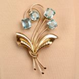 A 1940s 14ct gold aquamarine floral brooch.