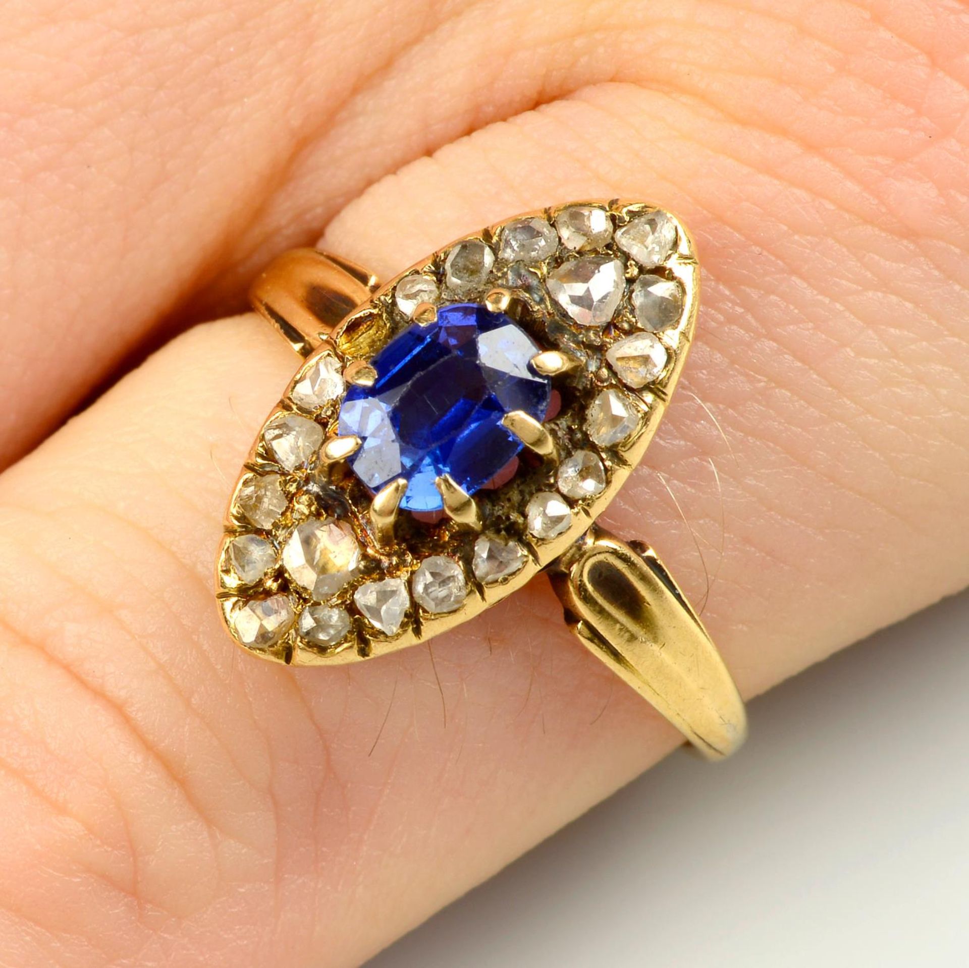 A late 19th century 18ct gold Ceylon sapphire and rose-cut diamond cluster ring.
