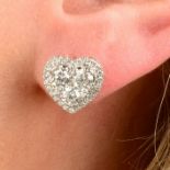 A pair of 18ct gold brilliant-cut diamond heart-shape cluster earrings.