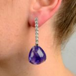 A pair of multi-faceted tanzanite and diamond earrings.