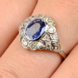 A sapphire and diamond cluster ring.